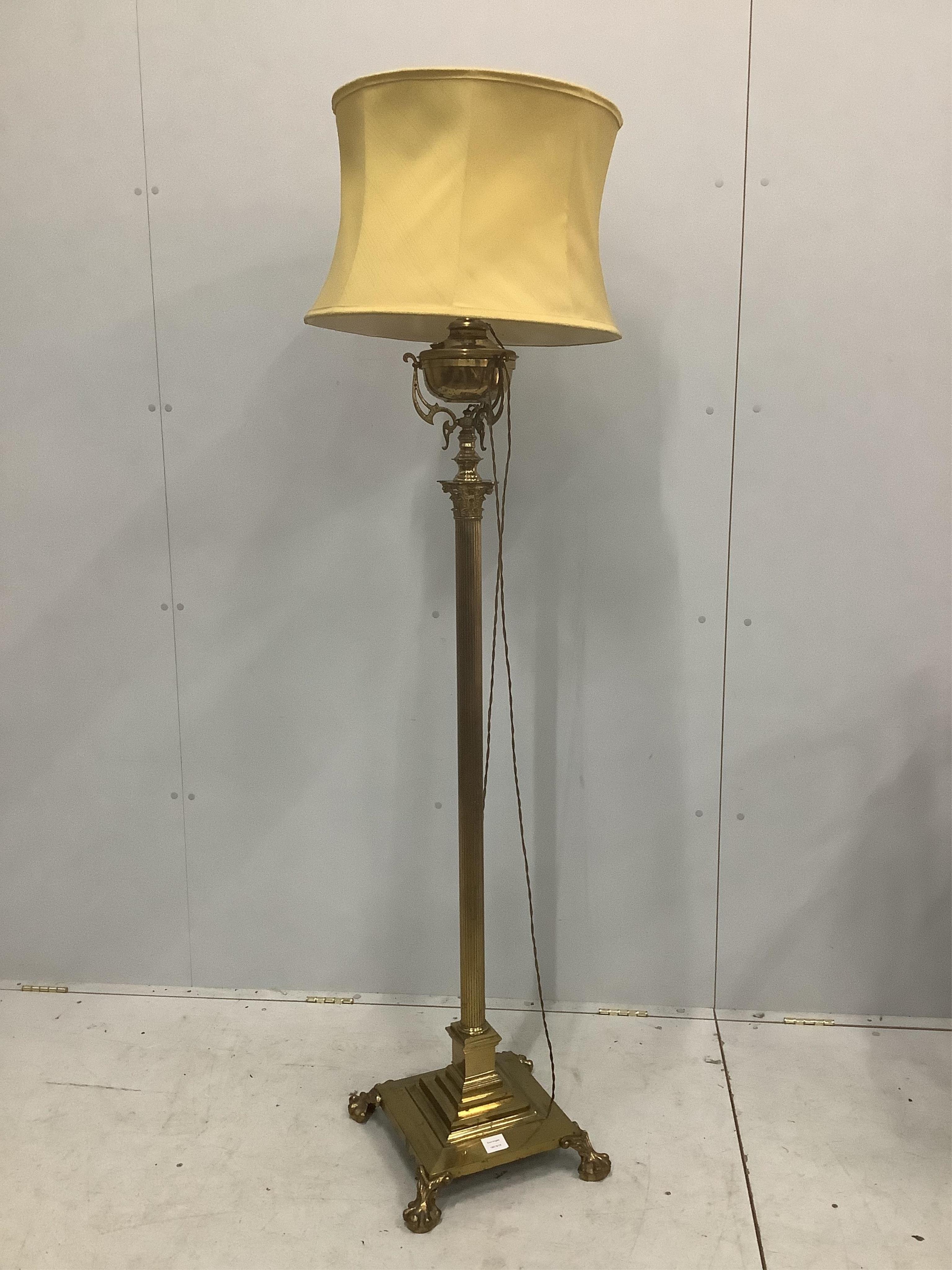 An Edwardian brass telescopic lamp standard, converted to electricity, height 180cm including shade. Condition - fair to good